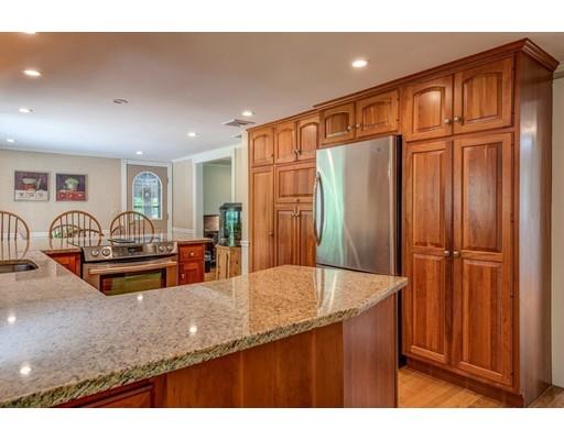 25 Woodside Road Topsfield, MA 01983 - Photo 12 of 37 a kitchen with stainless steel appliances granite countertop a sink refrigerator and cabinets