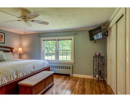 25 Woodside Road Topsfield, MA 01983 - Photo 23 of 37 a bedroom with a bed and a window