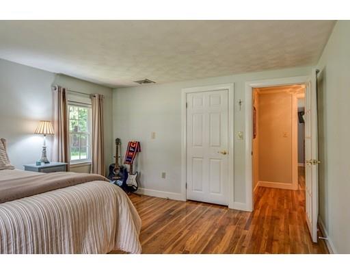 25 Woodside Road Topsfield, MA 01983 - Photo 27 of 37 a bedroom with a bed and a dresser