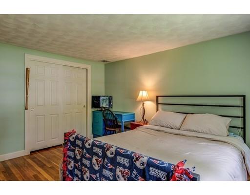 25 Woodside Road Topsfield, MA 01983 - Photo 29 of 37 a bedroom with a bed and a potted plant