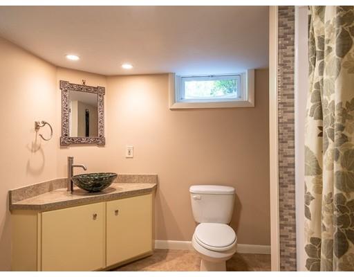 25 Woodside Road Topsfield, MA 01983 - Photo 32 of 37 a bathroom with a granite countertop toilet sink and mirror
