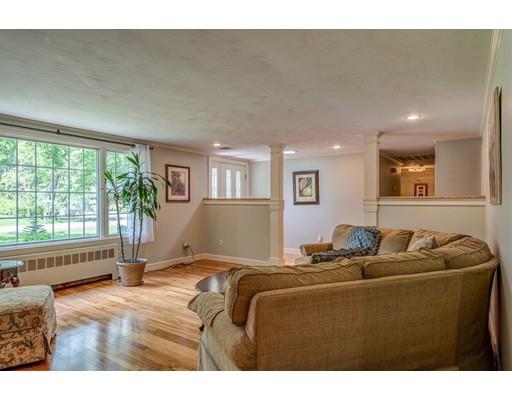 25 Woodside Road Topsfield, MA 01983 - Photo 8 of 37 a living room with furniture and a floor to ceiling window