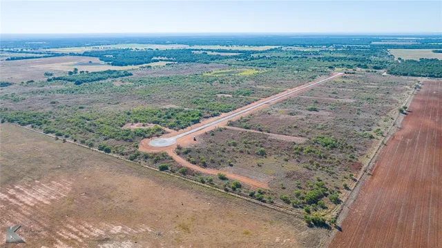 an aerial view of a house with beach and ocean view
