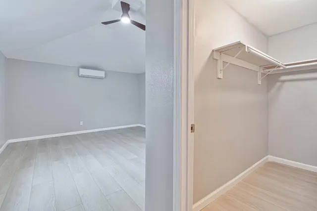 a view of an empty walk in closet