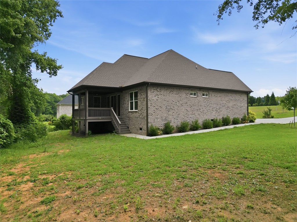 105 Bree Drive Anderson, SC 29621 - Photo 8 of 48 A classic brick exterior graces this inviting residence, featuring a screened porch perfect for outdoor living.