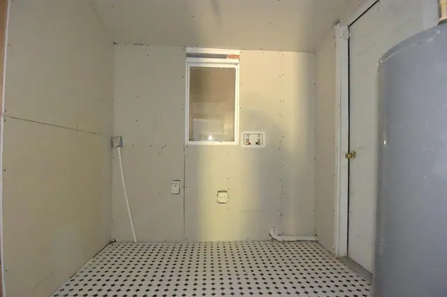 an empty room with closet and wooden floor