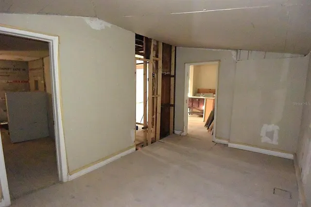 a view of an empty room with a window