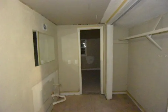 a view of empty room with windows