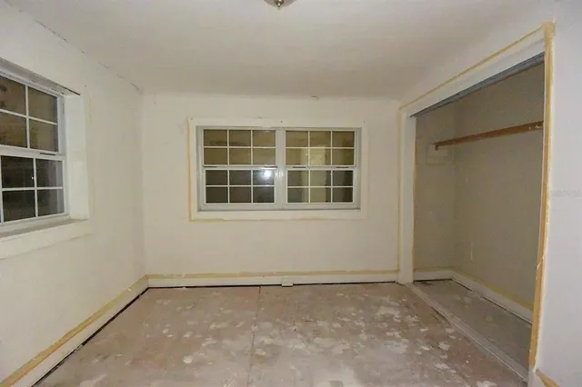 a view of empty room with windows