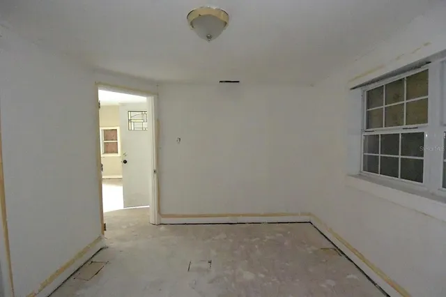 a view of an empty room with a window