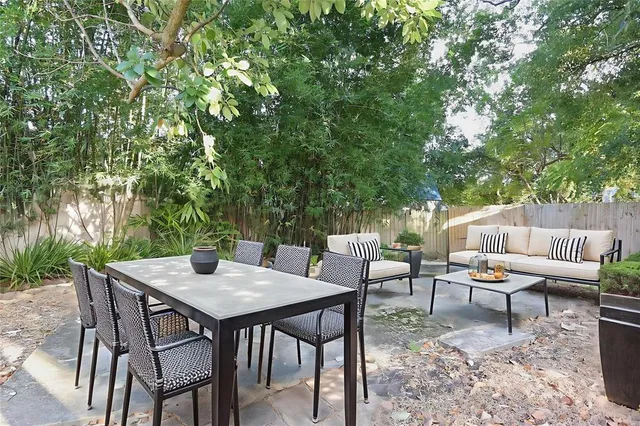 a wooden bench with view of trees