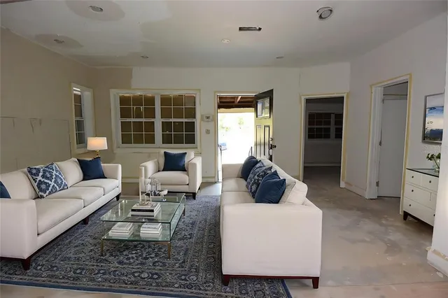 a living room with furniture and a rug