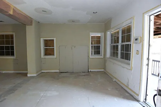 an empty room with windows