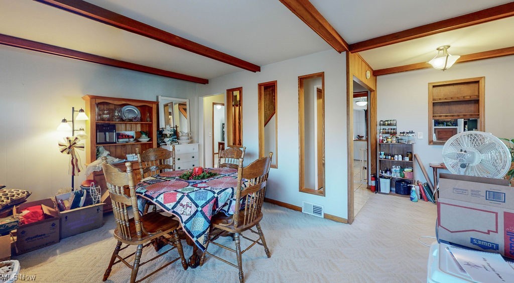 3180 Boston Road Brunswick, OH 44212 - Photo 8 of 41 Carpeted dining room featuring beamed ceiling