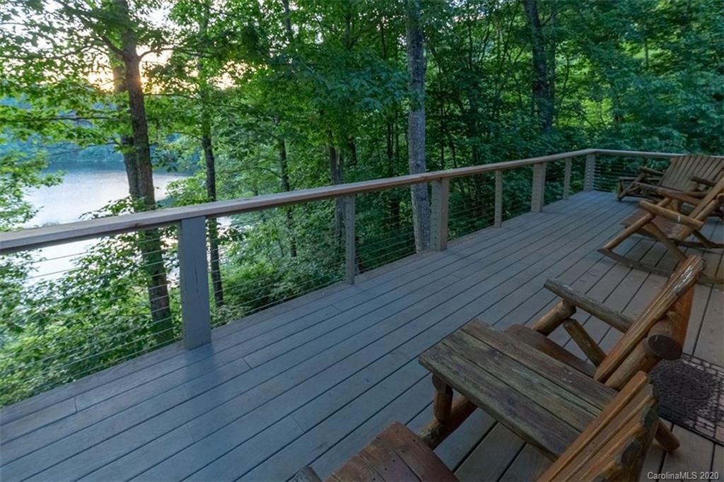 136 Dars Lane Tuckasegee, NC 28783 - Photo 11 of 48 a view of a balcony with wooden floor and outdoor space