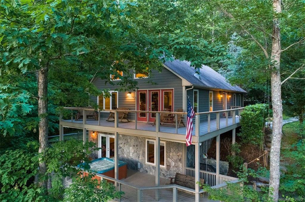 136 Dars Lane Tuckasegee, NC 28783 - Photo 3 of 48 front view of house with a yard and potted plants