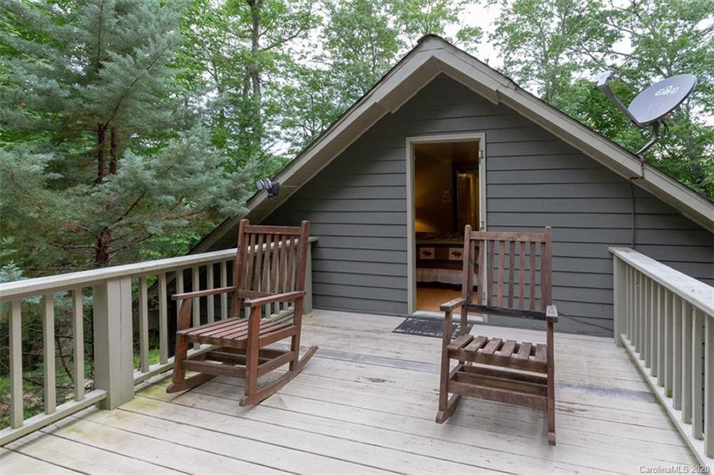 136 Dars Lane Tuckasegee, NC 28783 - Photo 25 of 48 a view of backyard with deck and outdoor seating