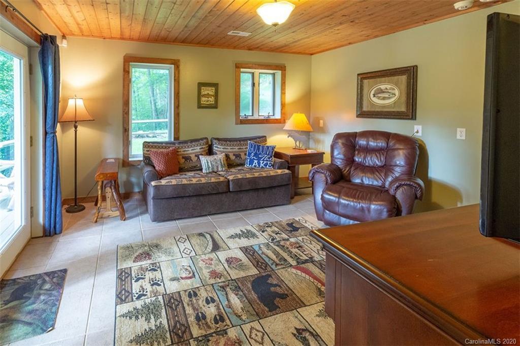 136 Dars Lane Tuckasegee, NC 28783 - Photo 27 of 48 a living room with furniture and a window