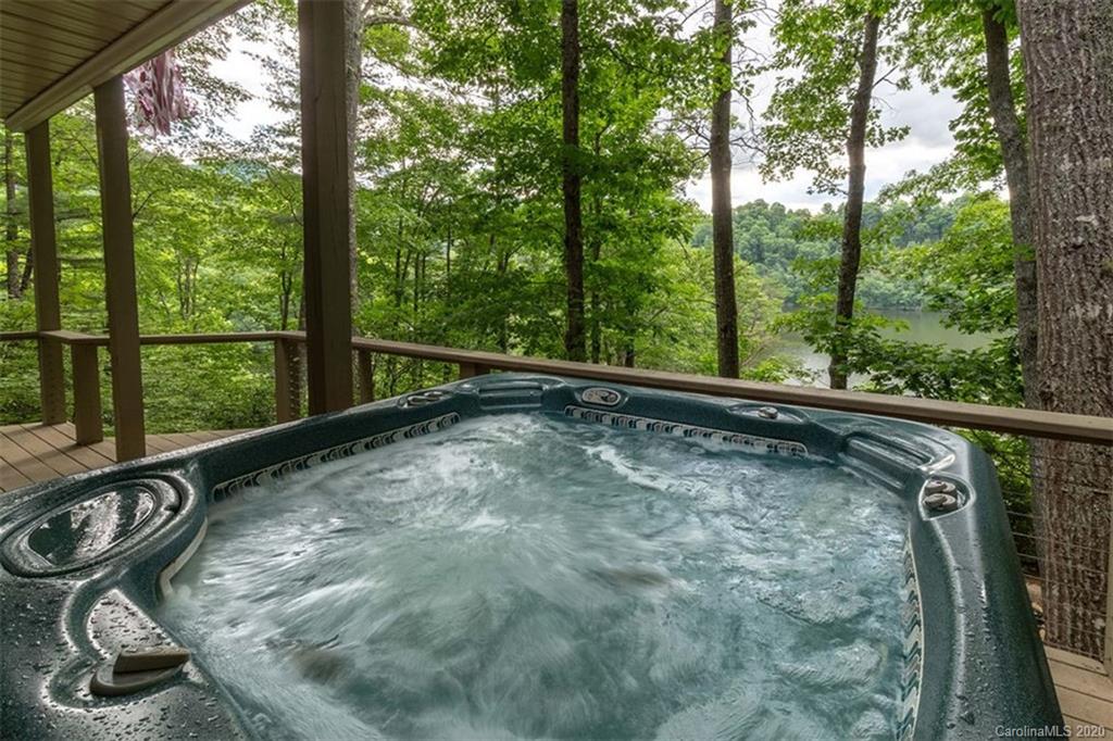 136 Dars Lane Tuckasegee, NC 28783 - Photo 32 of 48 a view of a balcony with swing