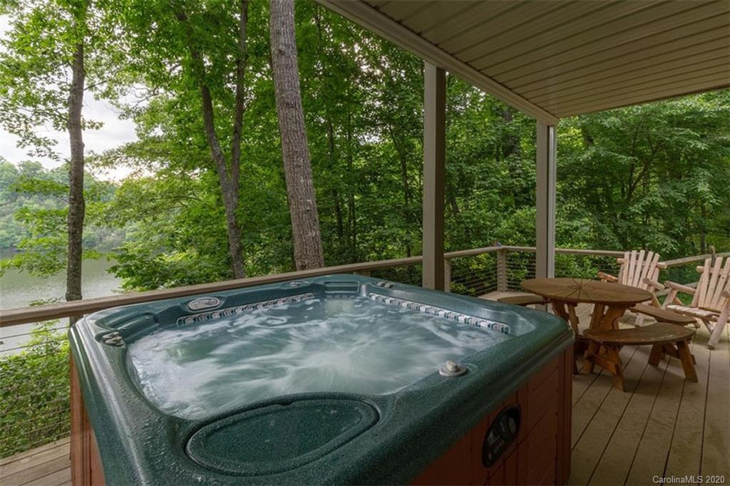 136 Dars Lane Tuckasegee, NC 28783 - Photo 33 of 48 a view of a wooden deck with chairs and wooden fence