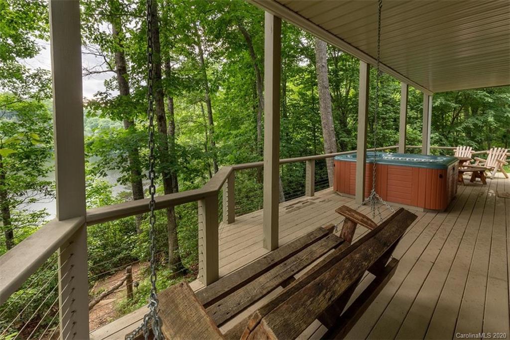 136 Dars Lane Tuckasegee, NC 28783 - Photo 34 of 48 a view of a balcony with wooden floor
