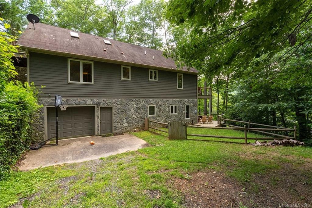 136 Dars Lane Tuckasegee, NC 28783 - Photo 36 of 48 a front view of a house with garden
