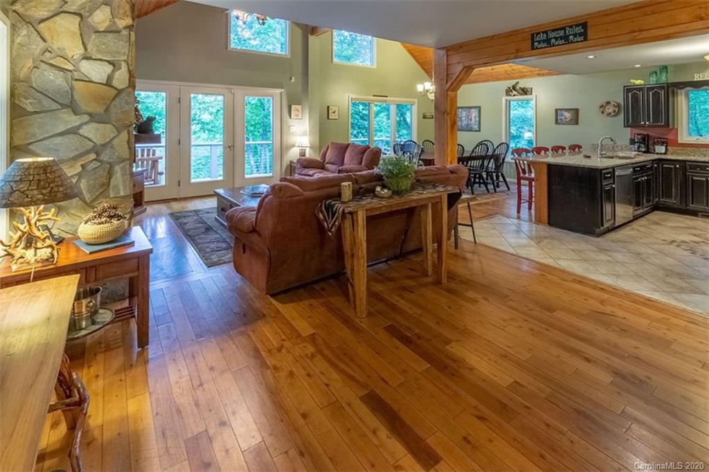 136 Dars Lane Tuckasegee, NC 28783 - Photo 5 of 48 a living room with furniture and wooden floor