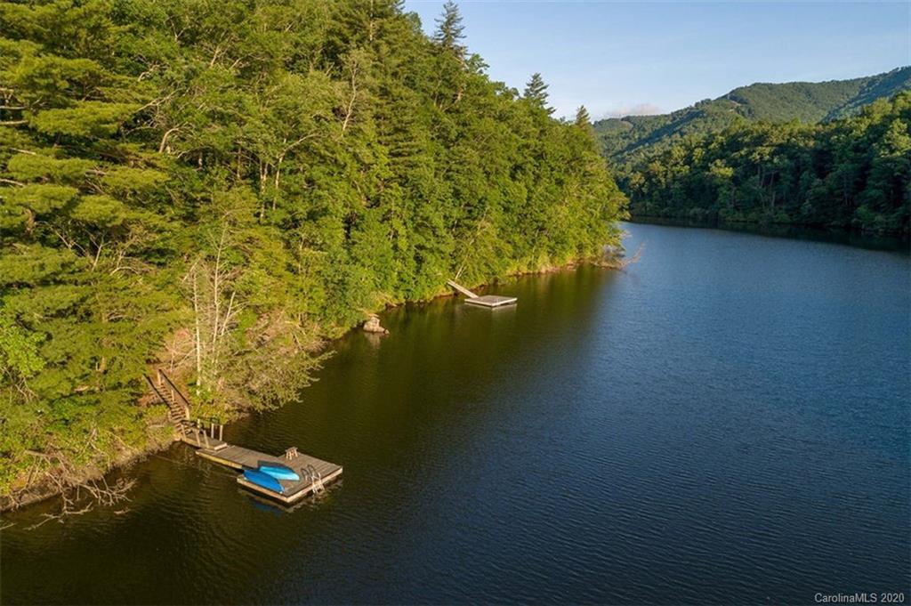 136 Dars Lane Tuckasegee, NC 28783 - Photo 42 of 48 a view of a lake with a mountain