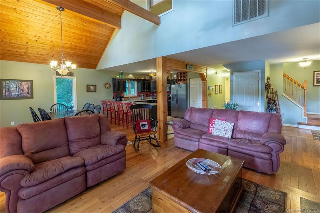 136 Dars Lane Tuckasegee, NC 28783 - Photo 6 of 48 a living room with furniture and a fireplace