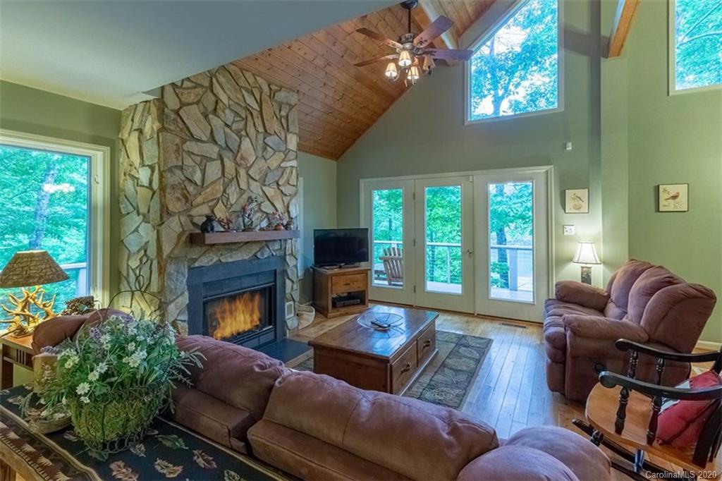 136 Dars Lane Tuckasegee, NC 28783 - Photo 7 of 48 a living room with furniture fireplace and flat screen tv