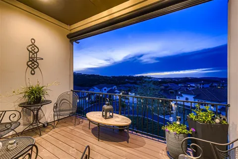 a view of a chairs and table in patio