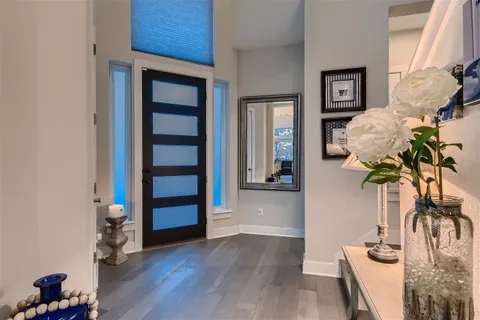 a view of living room filled with furniture and wooden floor