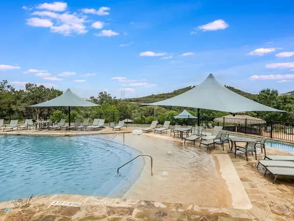 swimming pool view with a outdoor seating