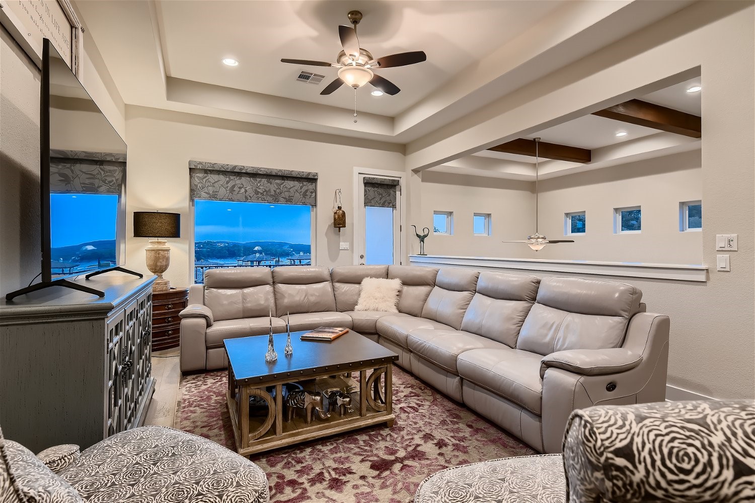 404 Marina View Way Lakeway, TX 78734 - Photo 8 of 23 a living room with furniture a rug and a chandelier