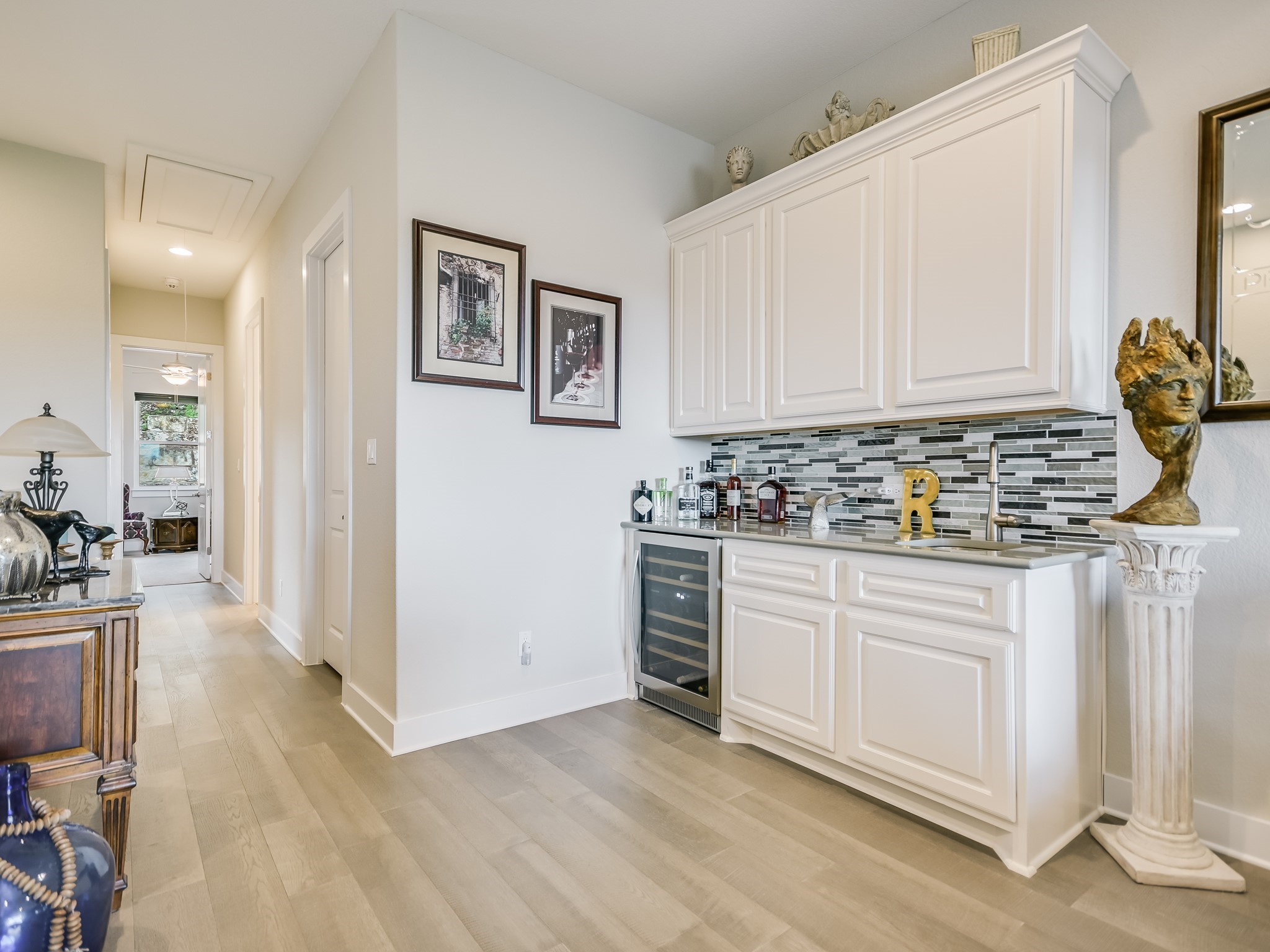 404 Marina View Way Lakeway, TX 78734 - Photo 10 of 23 a kitchen with stainless steel appliances granite countertop a stove and white cabinets