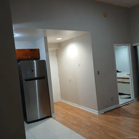 a view of a refrigerator in kitchen