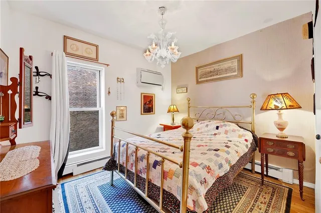 a bedroom with bed and a window