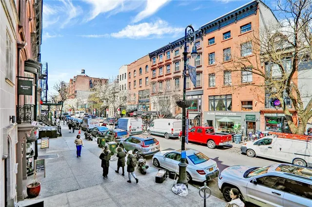 a city street filled with lots of furniture and cars