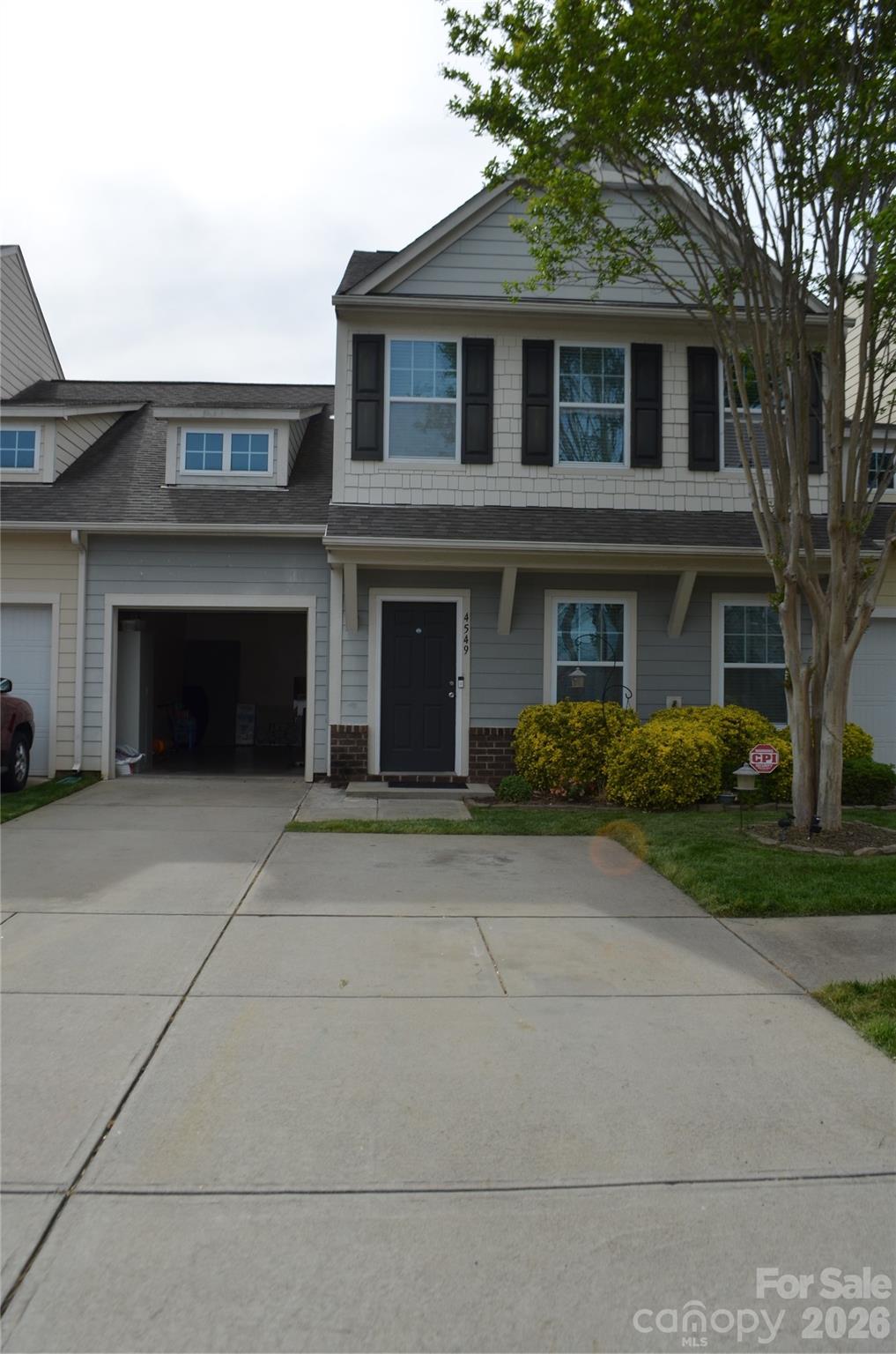 a front view of a house with yard
