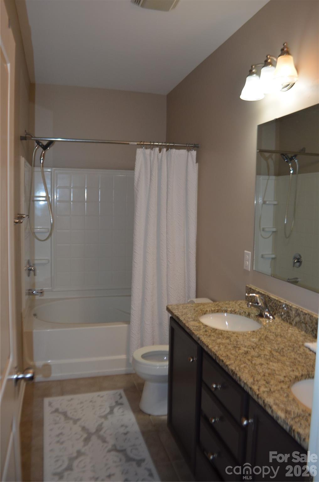 4549 Tradd Circle Monroe, NC 28110 - Photo 16 of 33 a bathroom with a granite countertop sink toilet and shower