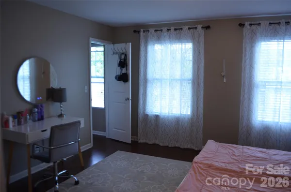 a bedroom with a bed and a closet