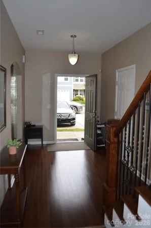 a view of an entryway with wooden floor