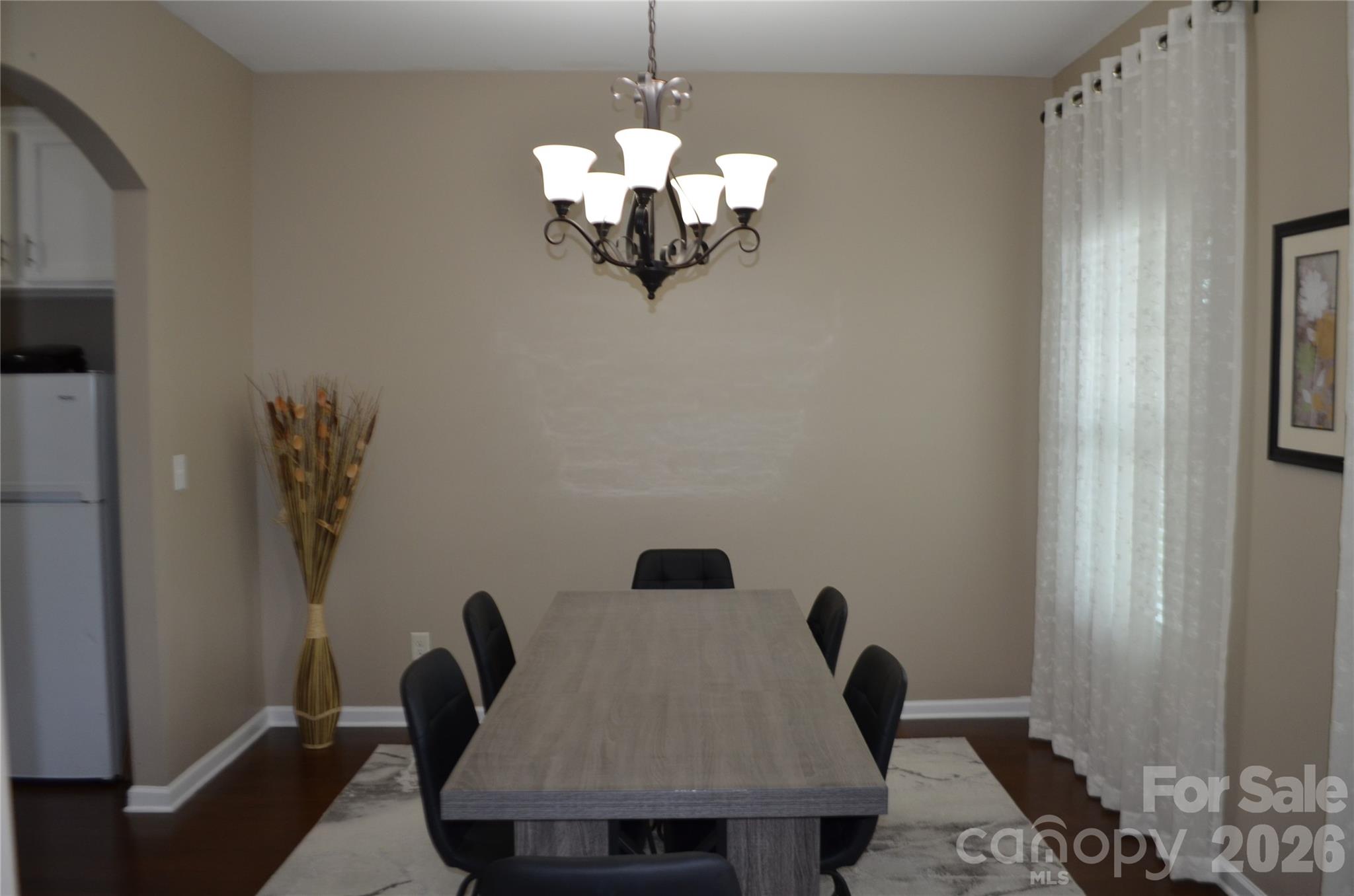4549 Tradd Circle Monroe, NC 28110 - Photo 7 of 33 a view of a dining room with furniture and wooden floor