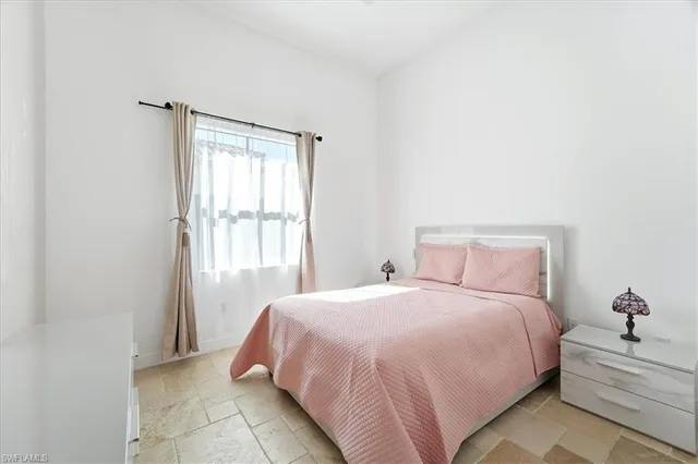 a bedroom with a bed and a closet