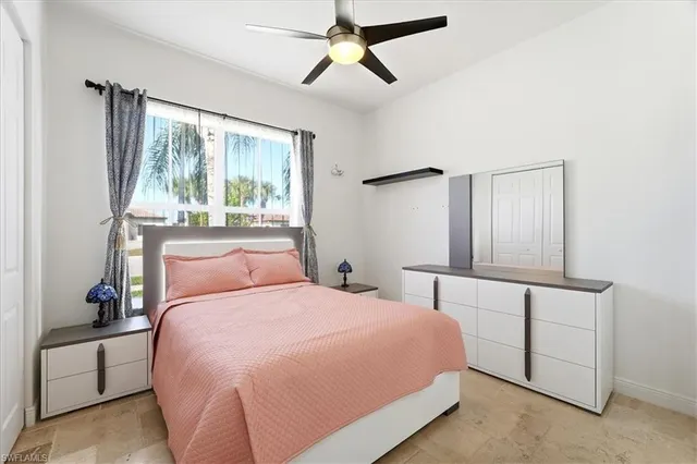 a bedroom with a bed and a shower