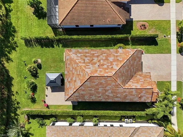 an aerial view of residential house with outdoor space and swimming pool