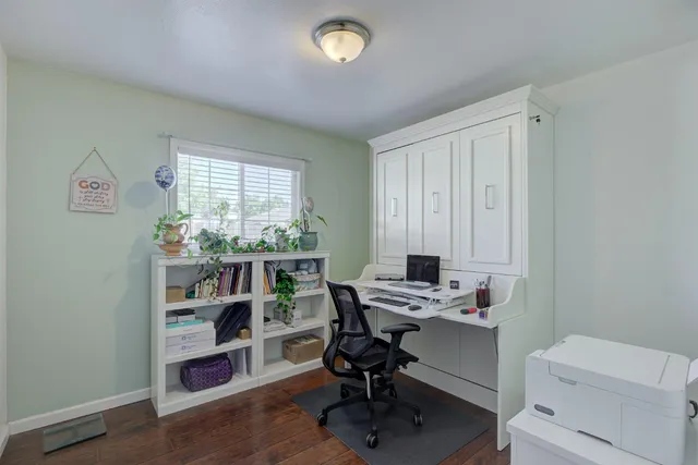 a bedroom with a bed and a bookshelf