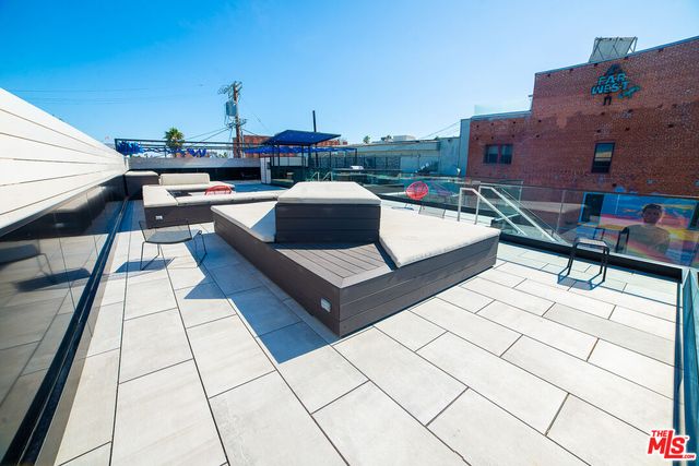 a view of a terrace with seating area