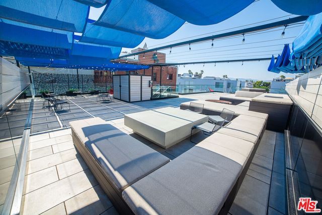 a view of a backyard with sitting area