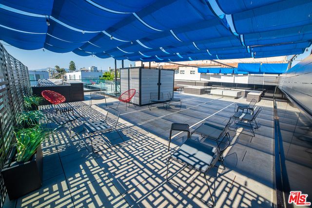 a view of a chairs and tables in patio